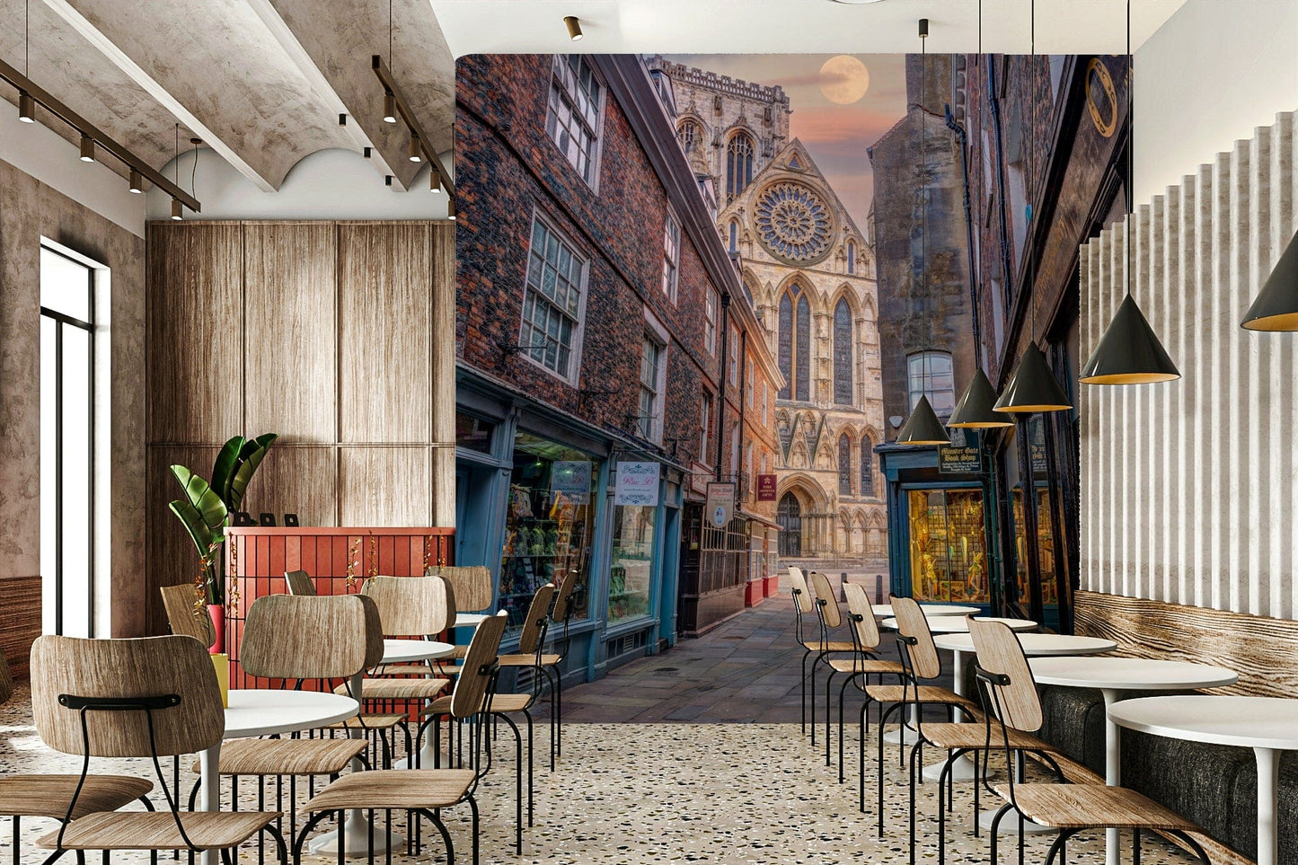 The mural shows an old European street with a cathedral.

