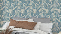 A wall mural of a zebra herd with artistic stripes.

